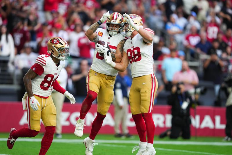 Nov 16, 2025; Glendale, Arizona, USA; San Francisco 49ers tight end George Kittle (85) celebrates scoring a touchdown with tight end Jake Tonges (88) and wide receiver Kendrick Bourne (84) in the first quarter against the Arizona Cardinals at State Farm Stadium. Mandatory Credit: Joe Camporeale-Imagn Images