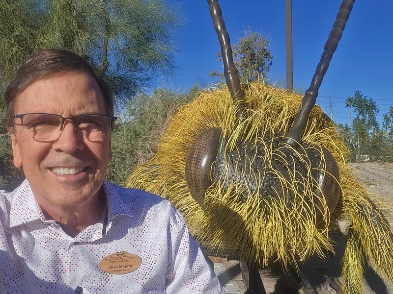 A giant pollinator poses with Living Desert President and CEO Alan Monroe at The Living Desert Zoo and Gardens.