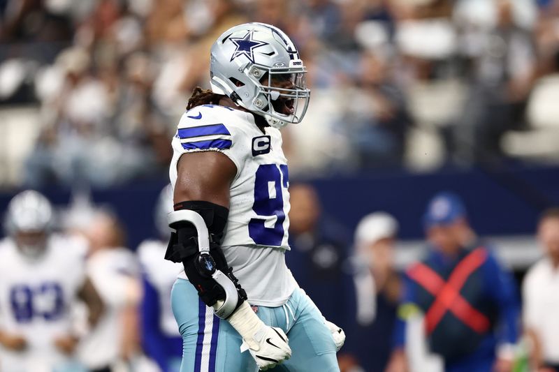 Sep 14, 2025; Arlington, Texas, USA; Dallas Cowboys defensive tackle Osa Odighizuwa (97) reacts after a play against the New York Giants during the second quarter at AT&T Stadium. Mandatory Credit: Kevin Jairaj-Imagn Images
