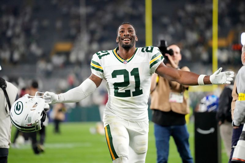 Sep 11, 2025; Green Bay, Wisconsin, USA; Green Bay Packers cornerback Nate Hobbs (21) celebrates after defeating the Washington Commanders at Lambeau Field. Mandatory Credit: Jeff Hanisch-Imagn Images