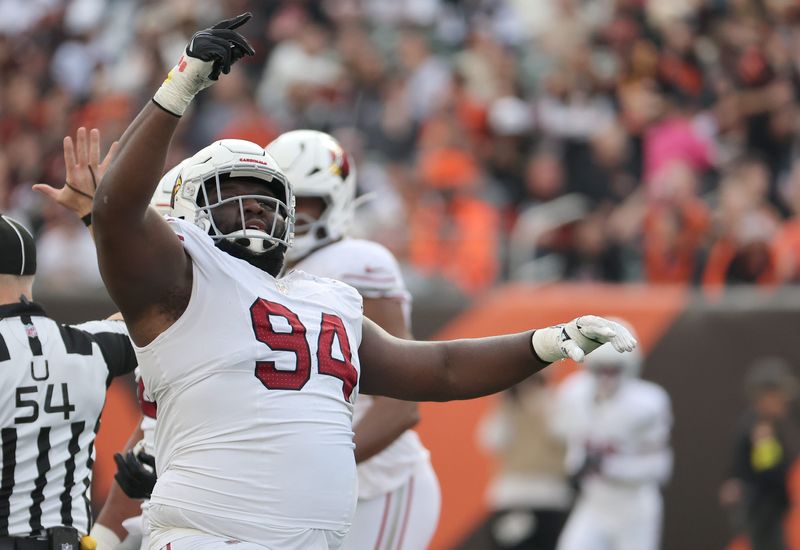 Dec 28, 2025; Cincinnati, Ohio, USA; Arizona Cardinals defensive tackle Dalvin Tomlinson (94) reacts after a play during the first half against the Cincinnati Bengals at Paycor Stadium. Mandatory Credit: Joseph Maiorana-Imagn Images