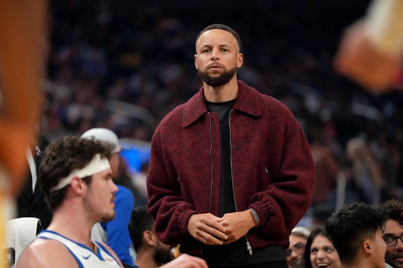 Mar 13, 2026; San Francisco, California, USA; Golden State Warriors guard Stephen Curry (30) stands near the team bench during a timeout against the Minnesota Timberwolves in the first quarter at the Chase Center. Mandatory Credit: Cary Edmondson-Imagn Images
