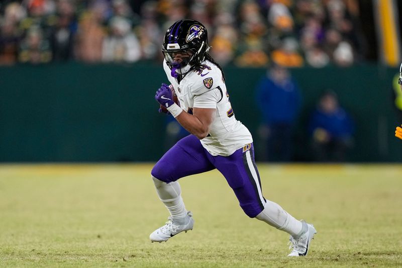 Dec 27, 2025; Green Bay, Wisconsin, USA; Baltimore Ravens running back Keaton Mitchell (34) during the game against the Baltimore Ravens at Lambeau Field. Mandatory Credit: Jeff Hanisch-Imagn Images