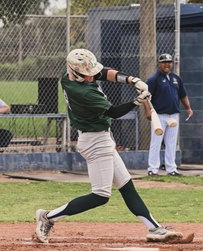Manteca’s Nate Slikker prepares to make contact with the ball during a game in his freshman season.