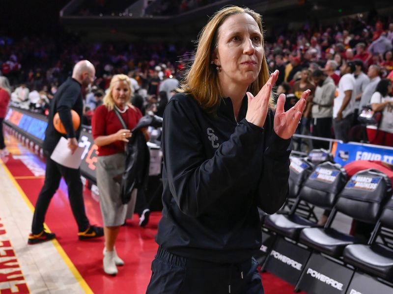 Mar 24, 2025; Los Angeles, California, USA; USC Trojans head coach Lindsay Gottlieb claps her hands as she walks off the court after the Trojans defeated the Mississippi State Bulldogs in an NCAA Tournament second round game at Galen Center. Mandatory Credit: Robert Hanashiro-Imagn Images