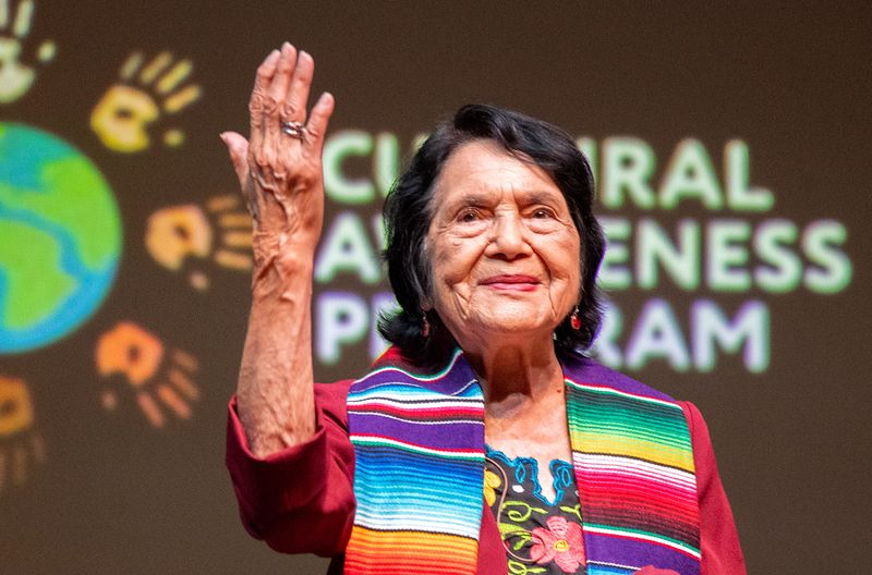 Farm labor leader/activist Dolores Huerta waves goodbye to the crowd after an interview and question and answer event at San Joaquin Delta College’s Atherton Auditorium in Stockton on Sept. 25, 2025.