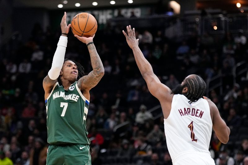 Mar 17, 2026; Milwaukee, Wisconsin, USA; Milwaukee Bucks guard/forward Kevin Porter Jr. (7) shoots against Cleveland Cavaliers guard James Harden (1) in the second half at Fiserv Forum. Mandatory Credit: Michael McLoone-Imagn Images
