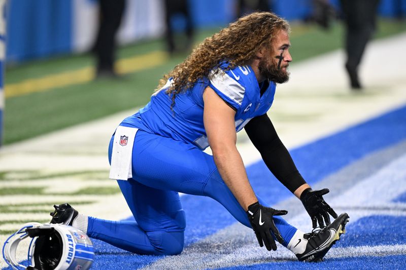 Sep 14, 2025; Detroit, Michigan, USA; Detroit Lions linebacker Grant Stuard (15) stetches during warmups prior to the game against the Chicago Bears at Ford Field. Mandatory Credit: Lon Horwedel-Imagn Images