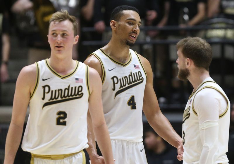 Purdue Boilermakers guard Fletcher Loyer (2), Purdue Boilermakers forward Trey Kaufman-Renn (4) and Purdue Boilermakers guard Braden Smith (3) huddle up Sunday, Dec. 8, 2024, during the NCAA menÃ¢â‚¬â„¢s basketball game against the Maryland Terrapins at Mackey Arena in West Lafayette, Ind. Purdue Boilermakers won 83-78.