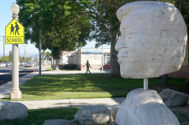 The bust of Cesar Chavez sits outside Cesar Chavez School in Oxnard on March 19. The late union leader and civil rights activist was recently accused of sexually abusing women and girls.