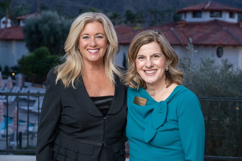Karen Devine and Tracy Fitzsimmons pose at the Olive Crest "Power of One" fundraising dinner on Feb. 19, 2026.