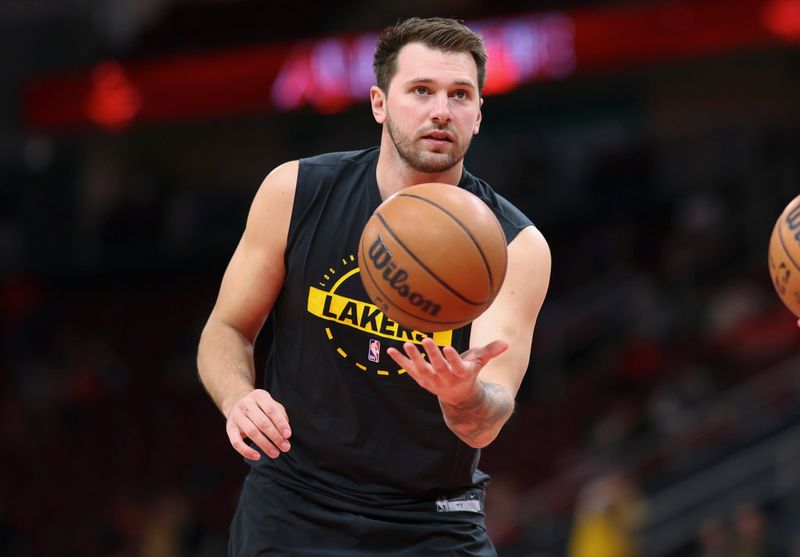 Mar 16, 2026; Houston, Texas, USA; Los Angeles Lakers guard Luka Doncic (77) warms up before the game against the Houston Rockets at Toyota Center. Mandatory Credit: Troy Taormina-Imagn Images