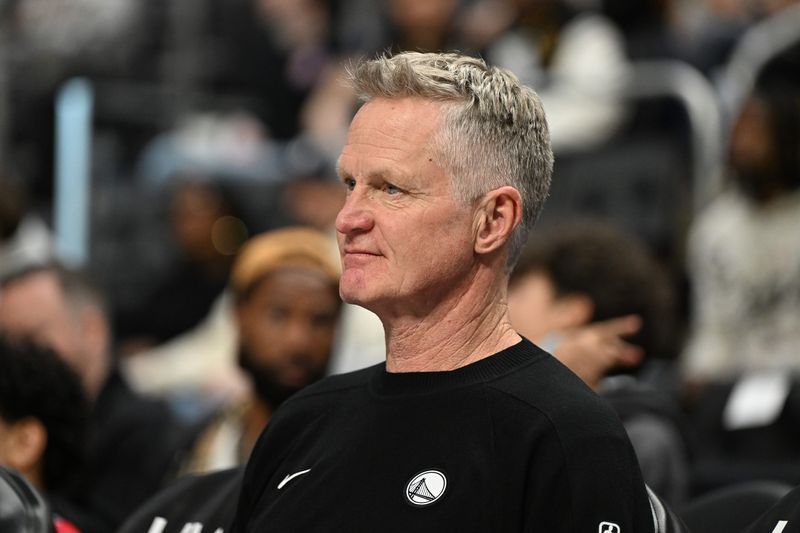 Mar 20, 2026; Detroit, Michigan, USA; Golden State Warriors head coach Steve Kerr sits on the bench watching players warm up before their game against the Detroit Pistons at Little Caesars Arena. Mandatory Credit: Lon Horwedel-Imagn Images