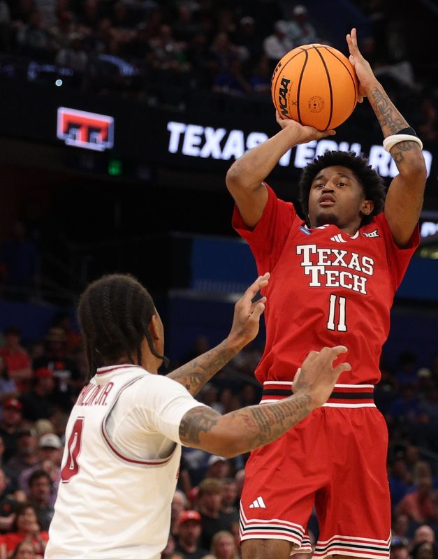 Mar 22, 2026; Tampa, FL, USA; Texas Tech Red Raiders guard Jaylen Petty (11) shoots over Alabama Crimson Tide guard Labaron Philon (0) in the first half during a second round game of the men's 2026 NCAA Tournament at Benchmark International Arena. Mandatory Credit: Nathan Ray Seebeck-Imagn Images