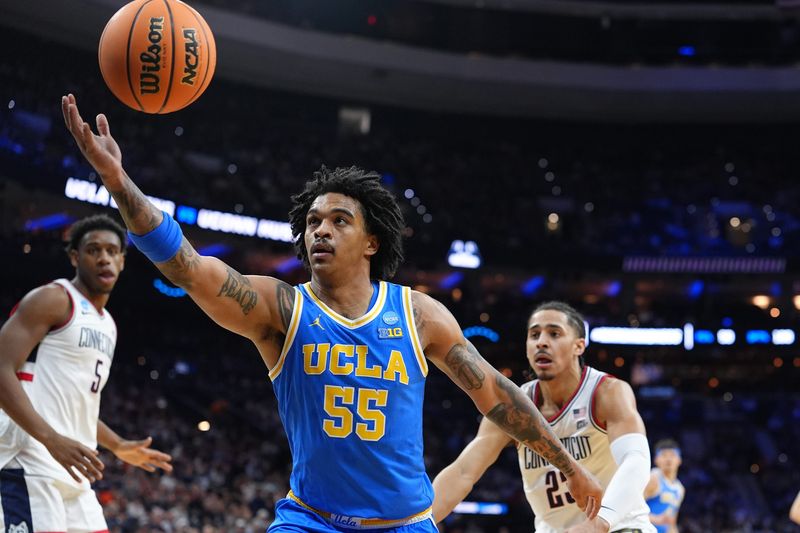 Mar 22, 2026; Philadelphia, PA, USA; UCLA Bruins guard Skyy Clark (55) reaches for a rebound against the UConn Huskies in the first half during a second round game of the men's 2026 NCAA Tournament at Xfinity Mobile Arena. Mandatory Credit: Kyle Ross-Imagn Images