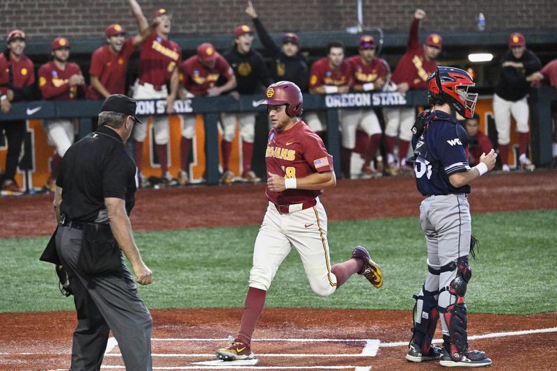 May 31, 2025; Corvallis, OR, USA; USC outfielder Kade Higgins (18) scores in the eight inning against Saint Mary's at the NCAA Corvallis Regional at Goss Stadium. Mandatory Credit: Troy Wayrynen-Imagn Images