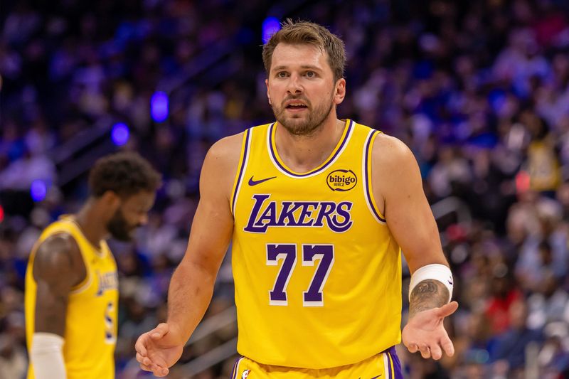 Mar 23, 2026; Detroit, Michigan, USA; Los Angeles Lakers Luka Doncic (77) reacts to a play against the Detroit Pistons during the second half at Little Caesars Arena. Mandatory Credit: David Reginek-Imagn Images