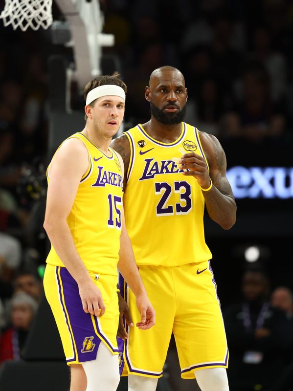 Feb 26, 2026; Phoenix, Arizona, USA; Los Angeles Lakers guard Austin Reaves (15) with forward LeBron James (23) against the Phoenix Suns at Mortgage Matchup Center. Mandatory Credit: Mark J. Rebilas-Imagn Images