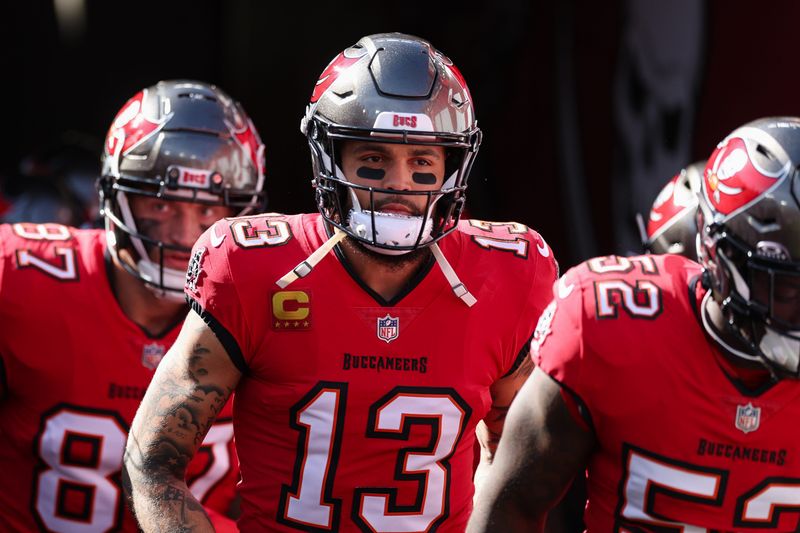 Jan 5, 2025; Tampa, Florida, USA; Tampa Bay Buccaneers wide receiver Mike Evans (13) takes the field for warm ups before a game against the New Orleans Saints at Raymond James Stadium. Mandatory Credit: Nathan Ray Seebeck-Imagn Images