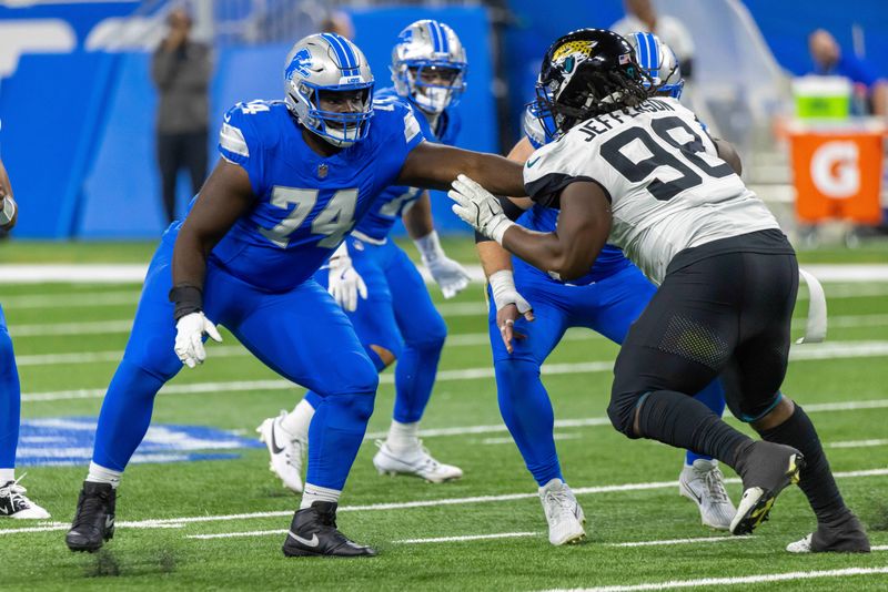 Nov 17, 2024; Detroit, Michigan, USA; Detroit Lions guard Kayode Awosika (74) defends against Jacksonville Jaguars defensive tackle Jordan Jefferson (98) during the second half at Ford Field. Mandatory Credit: David Reginek-Imagn Images