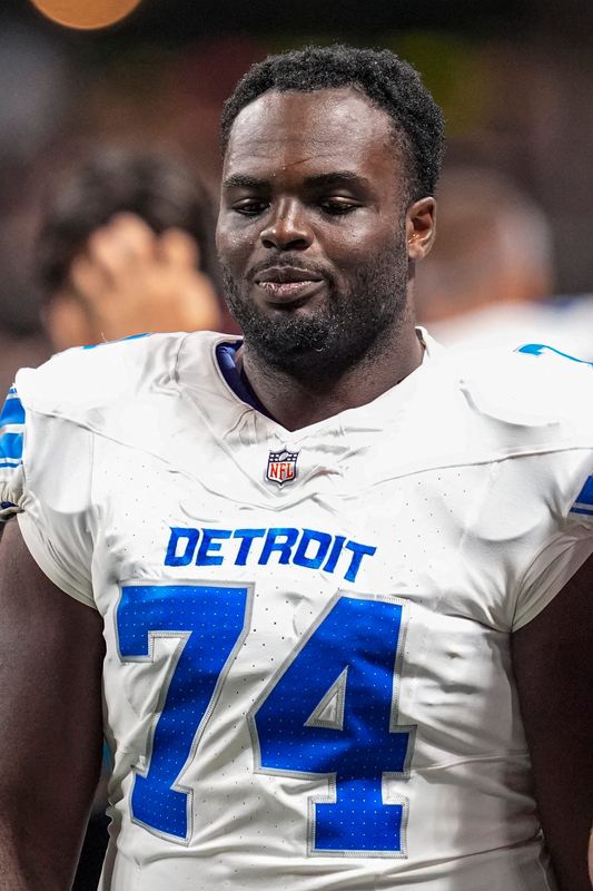 Aug 8, 2025; Atlanta, Georgia, USA; Detroit Lions guard Kayode Awosika (74) on the field against the Atlanta Falcons at Mercedes-Benz Stadium. Mandatory Credit: Dale Zanine-Imagn Images