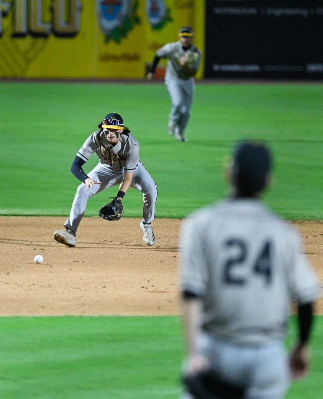 Golden West's Ethan Lopez fields a hit ball against Redwood in an East Yosemite League high school baseball game on Wednesday, March 25, 2026 at Valley Strong Ball Park.
