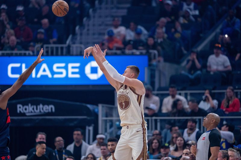 Mar 27, 2026; San Francisco, California, USA; Golden State Warriors center Kristaps Porzingis (7) makes a three point basket against the Washington Wizards during the first quarter at Chase Center. Mandatory Credit: Neville E. Guard-Imagn Images