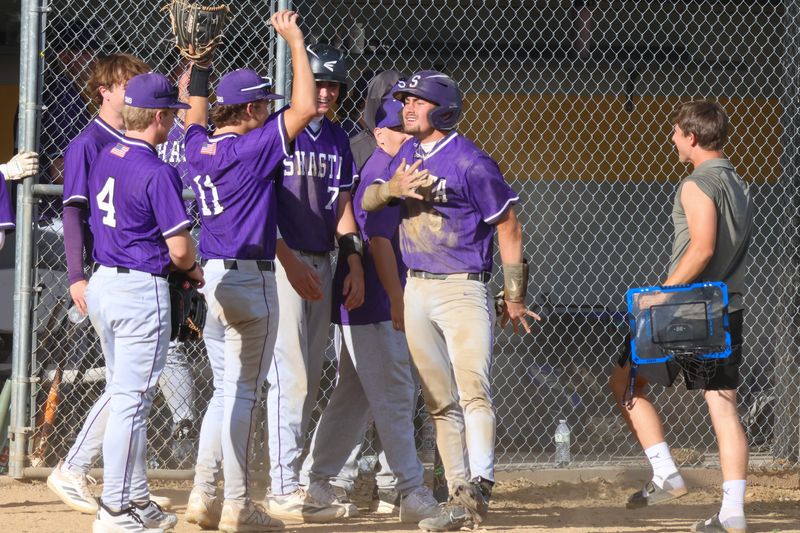 The Shasta baseball team cheers on Ty Jones after the senior scored a run. March 27, 2026.