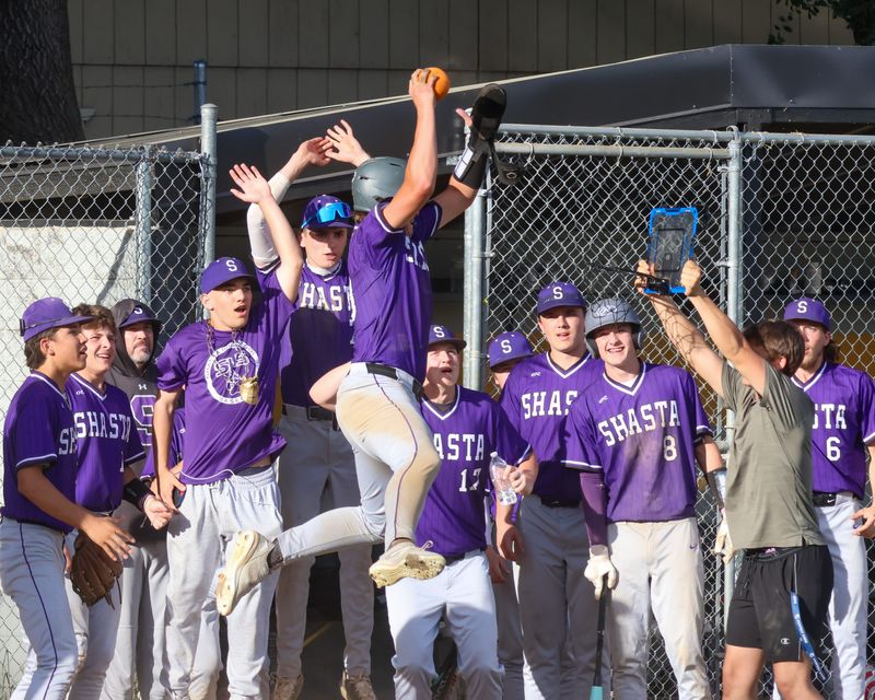 Shasta senior Jack Peterson dunks on the Wolves' mini hoop after scoring a run against Enterprise. "I'm pretty sure we saw it on TikTok," Peterson said of the ritual. "You just want to have fun, and it kind of gets everyone into it and gets some motivation going." March 27, 2026.