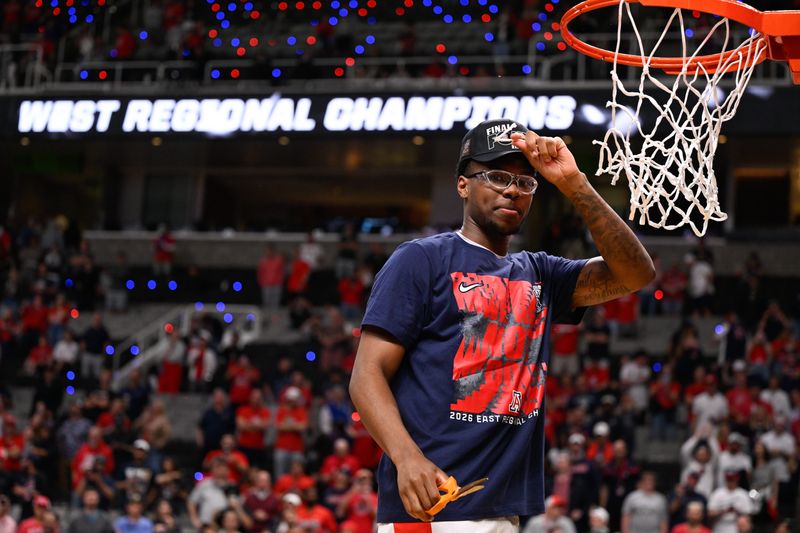 Mar 28, 2026; San Jose, CA, USA; Arizona Wildcats guard Bryce James (6) holds up a piece of the net after an Elite Eight game against the Purdue Boilermakers of the West Regional of the men's 2026 NCAA Tournament at SAP Center. Mandatory Credit: Eakin Howard-Imagn Images