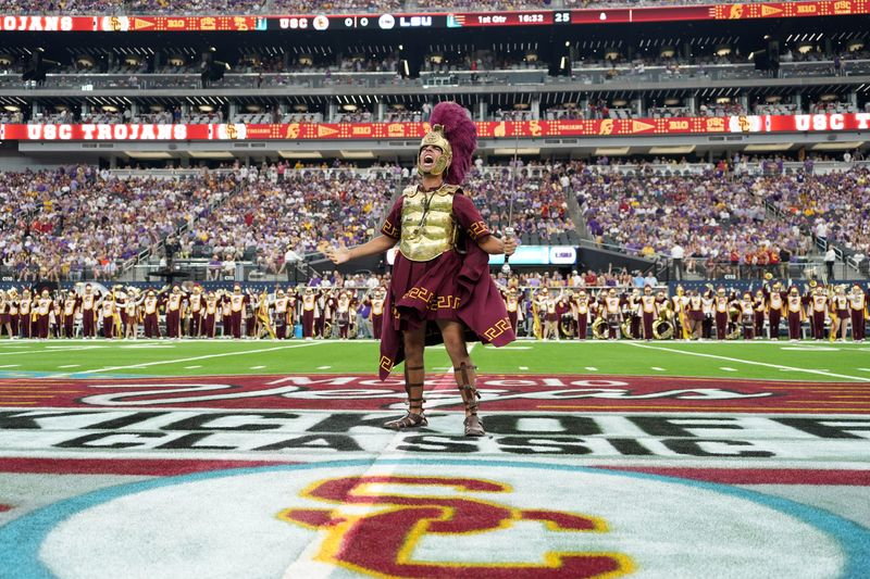 Sep 1, 2024; Paradise, Nevada, USA; Southern California Trojans mascot Tommy Trojan leads the Spirit of Troy marching band onto the field before the game against the LSU Tigers at Allegiant Stadium. Mandatory Credit: Kirby Lee-USA TODAY Sports