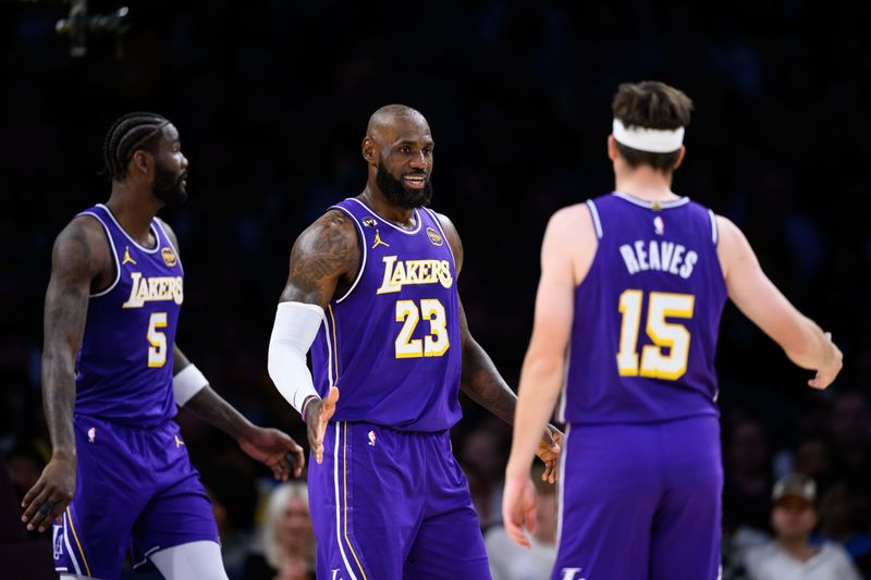 Mar 27, 2026; Los Angeles, California, USA; Los Angeles Lakers forward LeBron James (23) is greeted by teammates after scoring during the first half against the Brooklyn Nets at Crypto.com Arena. Mandatory Credit: William Liang-Imagn Images