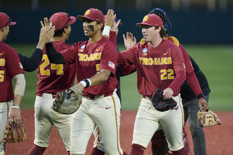May 31, 2025; Corvallis, OR, USA; USC pitcher Caden Hunter (22) high-fives teammates after a game against Saint Mary's at the NCAA Corvallis Regional at Goss Stadium. Mandatory Credit: Troy Wayrynen-Imagn Images
