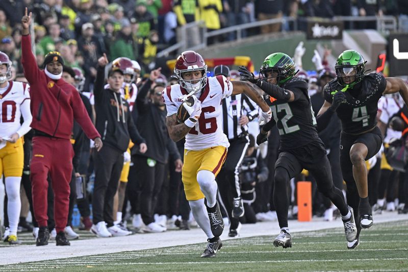 Nov 22, 2025; Eugene, Oregon, USA; Southern California Trojans wide receiver Tanook Hines (16) runs with the ball during the first half against the Oregon Ducks at Autzen Stadium. Mandatory Credit: Troy Wayrynen-Imagn Images