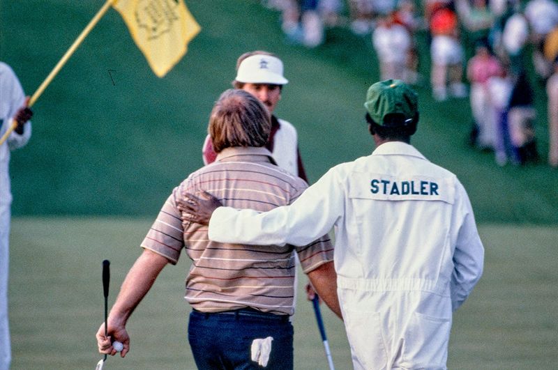 Craig Stadler and caddy Ben Bussey walk off the 10th green after Stadler beat Dan Pohl in a playoff to win the 1982 Masters at Augusta National Golf Club.