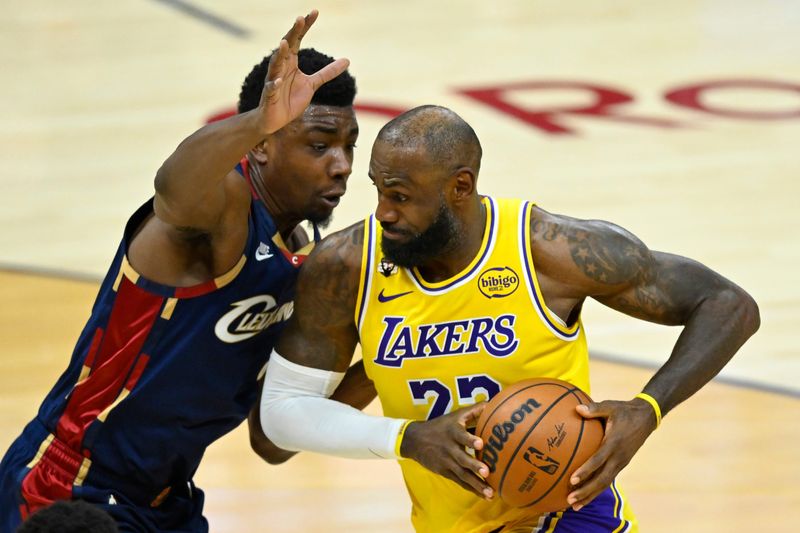 Jan 28, 2026; Cleveland, Ohio, USA; Cleveland Cavaliers center Thomas Bryant (3) defends Los Angeles Lakers forward LeBron James (23) in the fourth quarter at Rocket Arena. Mandatory Credit: David Richard-Imagn Images