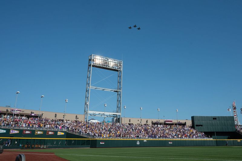 Jun 21, 2025; Omaha, Neb, USA; Three F-16 Fighting Falcons perform a fly over before the game between the Coastal Carolina Chanticleers and the LSU Tigers at Charles Schwab Field. Mandatory Credit: Steven Branscombe-Imagn Images