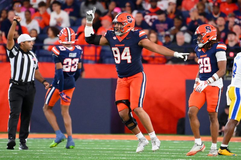 Oct 18, 2025; Syracuse, New York, USA; Syracuse Orange defensive lineman Kevin Jobity Jr. (94) reacts to a defensive play against the Pittsburgh Panthers during the second half at the JMA Wireless Dome. Mandatory Credit: Rich Barnes-Imagn Images