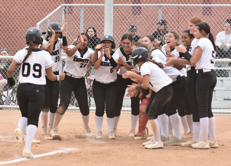 Riverside Prep's Daisy Hernandez, left, is met at home by teammates after hitting a walk-off home run against Hesperia Christian on Tuesday, March 31, 2026. Riverside Prep won 13-3 to begin Cross Valley League play.