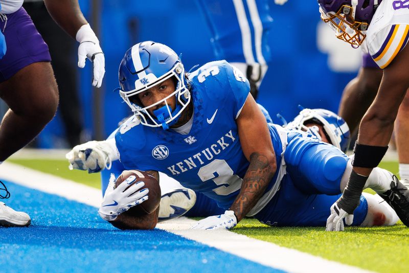 Nov 15, 2025; Lexington, Kentucky, USA; Kentucky Wildcats running back Seth McGowan (3) falls into the end zone for a touchdown during the first quarter against the Tennessee Tech Golden Eagles at Kroger Field. Mandatory Credit: Jordan Prather-Imagn Images