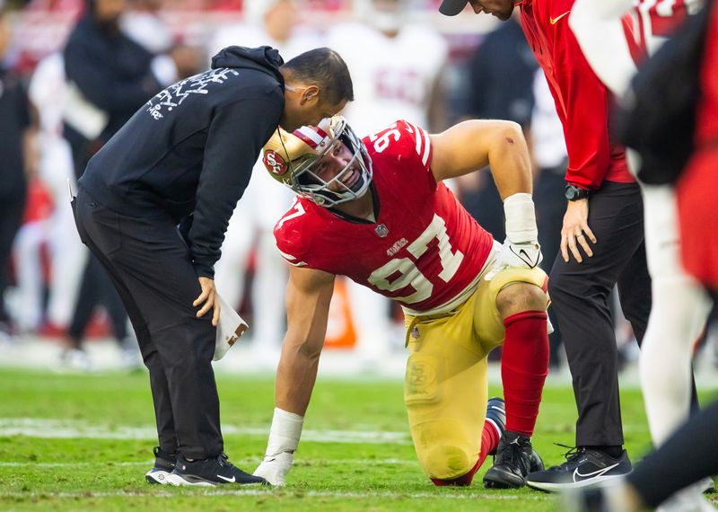 Dec 17, 2023; Glendale, Arizona, USA; San Francisco 49ers defensive end Nick Bosa (97) reacts after suffering an injury against the Arizona Cardinals at State Farm Stadium. Mandatory Credit: Mark J. Rebilas-USA TODAY Sports