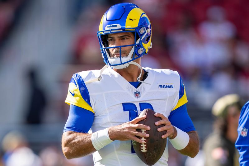 November 9, 2025; Santa Clara, California, USA; Los Angeles Rams quarterback Jimmy Garoppolo (11) warms up before the game against the San Francisco 49ers at Levi's Stadium. Mandatory Credit: Kyle Terada-Imagn Images