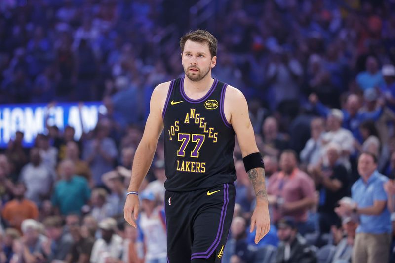 Apr 2, 2026; Oklahoma City, Oklahoma, USA; Los Angeles Lakers guard Luka Doncic (77) walks across the court during the first quarter against the Oklahoma City Thunder at Paycom Center. Mandatory Credit: Alonzo Adams-Imagn Images