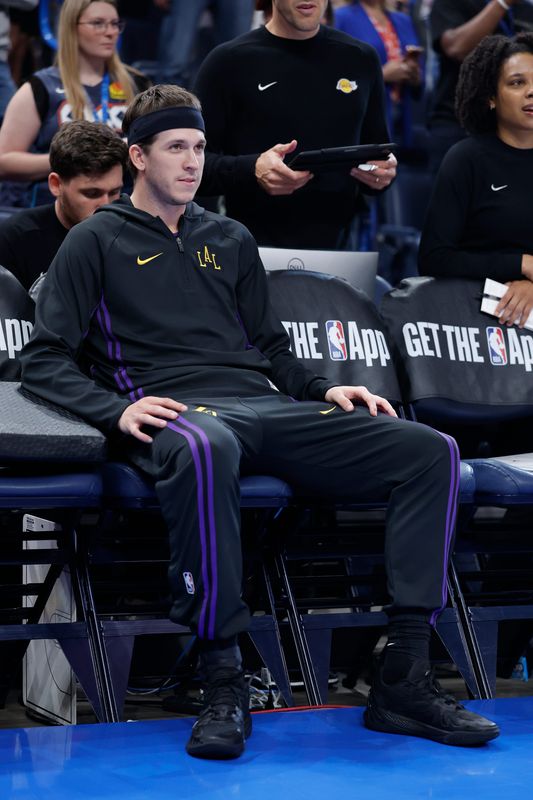 Apr 2, 2026; Oklahoma City, Oklahoma, USA; Los Angeles Lakers guard Austin Reaves (15) sits on the bench before a game against the Oklahoma City Thunder at Paycom Center. Mandatory Credit: Alonzo Adams-Imagn Images