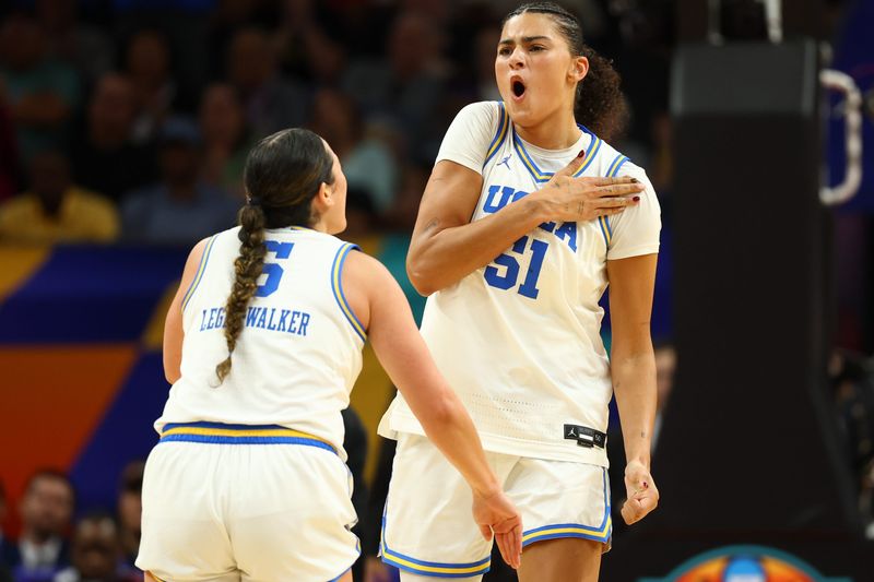Apr 5, 2026; Phoenix, AZ, USA; UCLA Bruins center Lauren Betts (51) and guard Charlisse Leger-Walker (5) react in the third quarter against the South Carolina Gamecocks during the National Championship game of the women's 2026 NCAA Tournament at Mortgage Matchup Center. Mandatory Credit: Mark J. Rebilas-Imagn Images