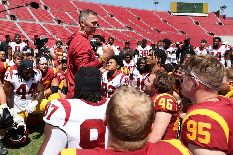 Apr 15, 2023; Los Angeles, CA, USA; USC Trojans head coach Lincoln Riley talks to players at the conclusion of the Spring Game at Los Angeles Memorial Coliseum. Mandatory Credit: Kiyoshi Mio-USA TODAY Sports