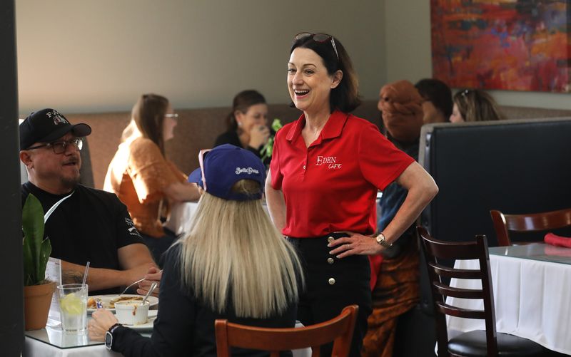 Myriam Thevenet talks to local customers, Patrick and Tiffany Lozano at the Eden Cafe that she co-owns in downtown Tulare, Calif. that serves great French food while giving back to the community as a nonprofit Saturday, March 28, 2026.