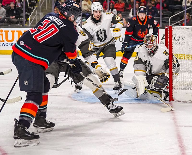 Coachella Valley Firebirds forward Cooper Marody breaks his stick as he takes a shot on Henderson Silver Knights goalie Carl Lindbom during the first period of their game at Acrisure Arena in Palm Desert, Calif., Wednesday, April 8, 2026.