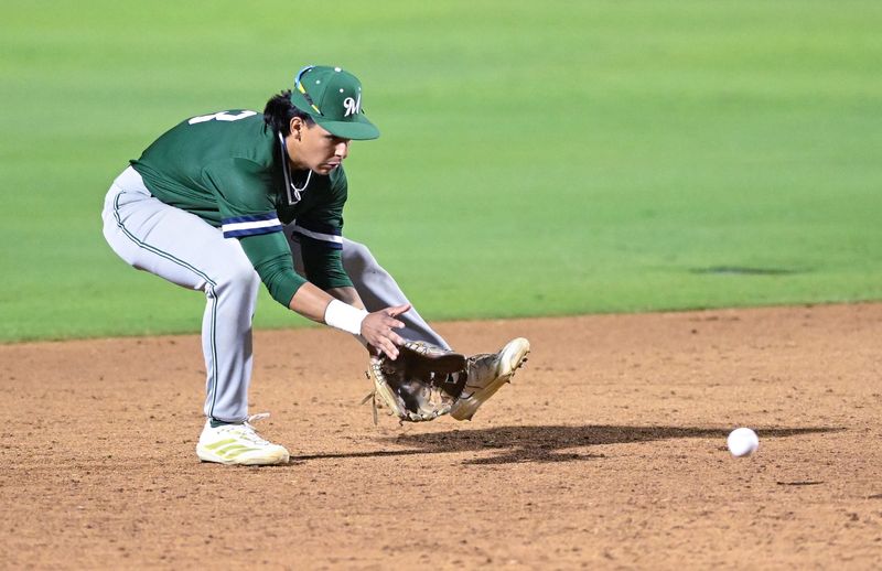 El Diamante's Aden Robles scoops up a hit ball against Redwood in East Yosemite League high school baseball Wednesday, April 8, 2026.