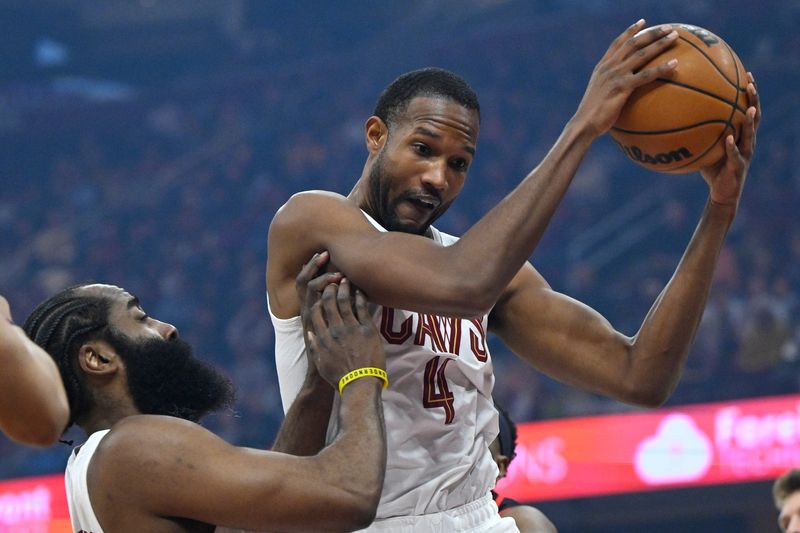 Apr 8, 2026; Cleveland, Ohio, USA; Cleveland Cavaliers center Evan Mobley (4) rebounds beside guard James Harden (1) in the first quarter against the Atlanta Hawks at Rocket Arena. Mandatory Credit: David Richard-Imagn Images